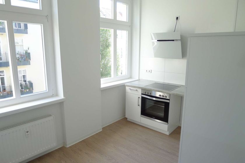 Atmosphärischer Altbauklassiker mit Dielen und EBK - tolle Lage Radickestraße! - Foto 2
