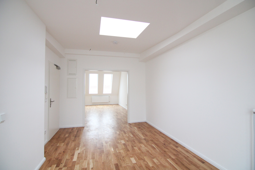 Wohnzimmer mit offener Küche