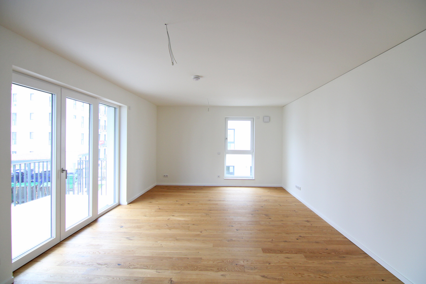 Wohnzimmer mit offener Küche