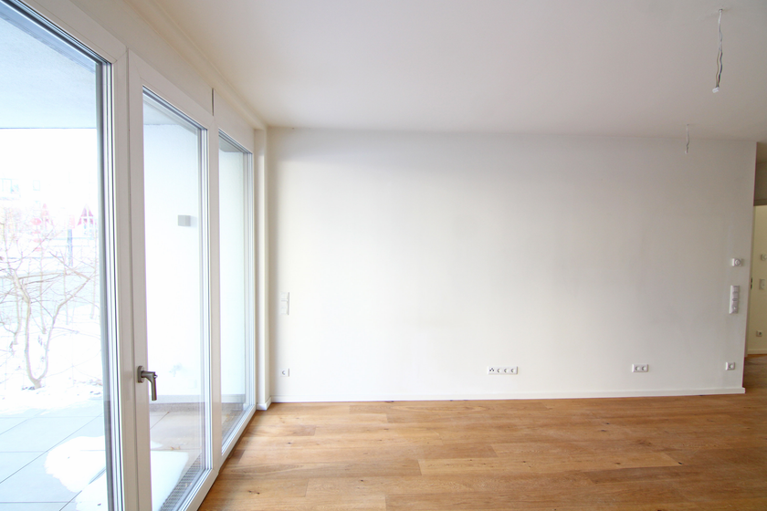 Wohnzimmer mit offener Küche